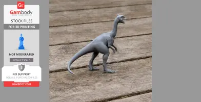 Gray 3D-printed dinosaur model, standing on a wooden surface.