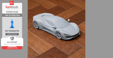 A detailed 3D-printed model of a sleek sports car on a wooden floor.