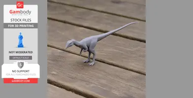 A small, gray 3D printed Procompsognathus model stands on a wooden surface.