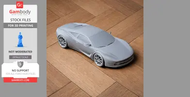 A gray 3D-printed model of a sleek car on a wooden surface.
