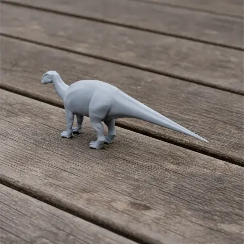 A 3D-printed Protohadros model standing on a wooden surface.
