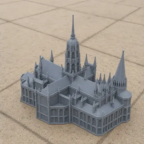 3D printed model of Bayeux Cathedral with detailed spires and arches on tiled surface.