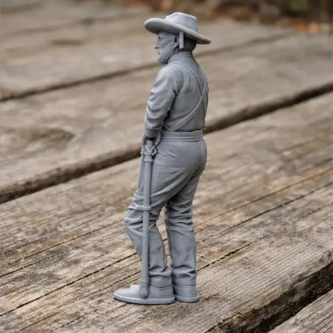 3D printed model of a Civil War soldier with a hat and rifle, standing on weathered wood.
