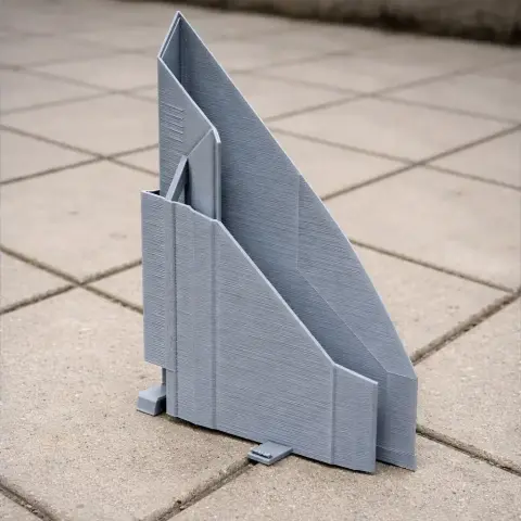 3D-printed model of modernist architecture with angular geometric shapes.