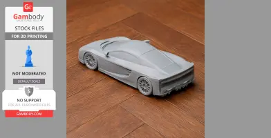 A 3D-printed model of a sleek sports car, the Ascari KZ1, on a wooden floor.