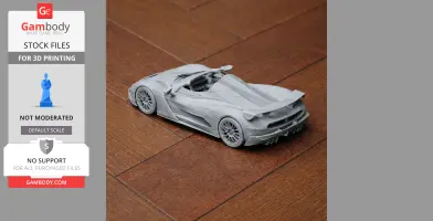 3D printed model of a sleek sports car on a wooden surface.