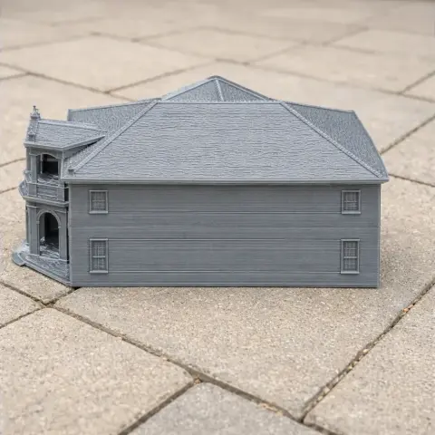 3D printed model of a Georgian-style building with detailed windows and roof on a paved surface.