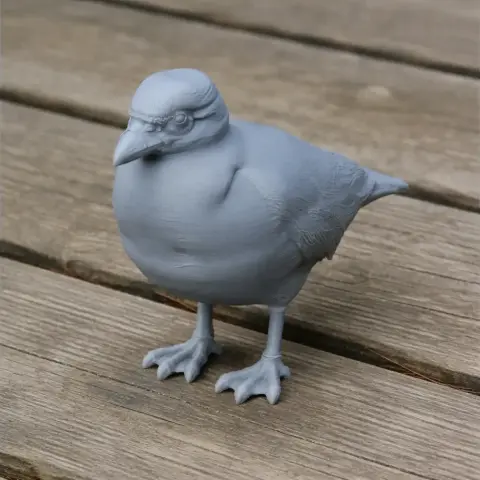 3D-printed model of a prehistoric Sheathbill bird standing on a wooden surface.
