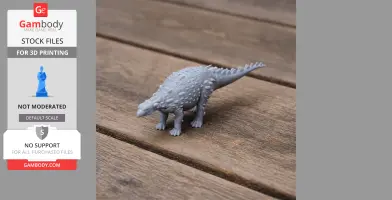 Gray 3D-printed Silvisaurus model with bumpy texture standing on wooden surface.