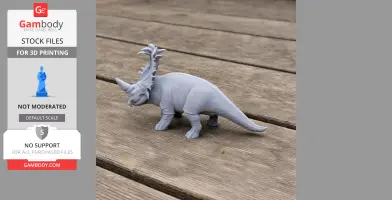 Gray 3D printed Sinoceratops model on wooden surface.
