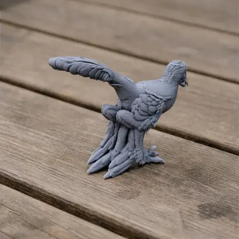 3D printed Sinornithosaurus model on wooden surface, detailed with feathers and perched pose.