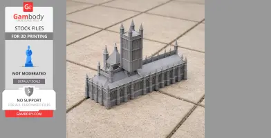 Gray 3D-printed model of Gloucester cathedral with detailed towers and arches on a tiled surface.