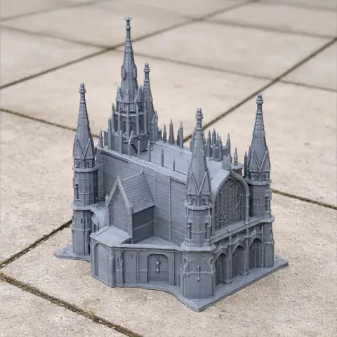 Intricate 3D model of a Gothic Revival cathedral with spires and arches, set on a tiled surface.