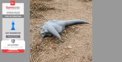 3D-printed gazelle skull replica with long, curved horns set on a rough, sandy surface.