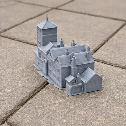 A detailed 3D-printed model of Groby Castle on paving stones.