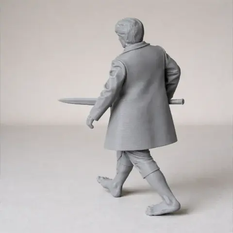 Gray 3D-printed figure holding a sword, wearing a coat, and walking barefoot.