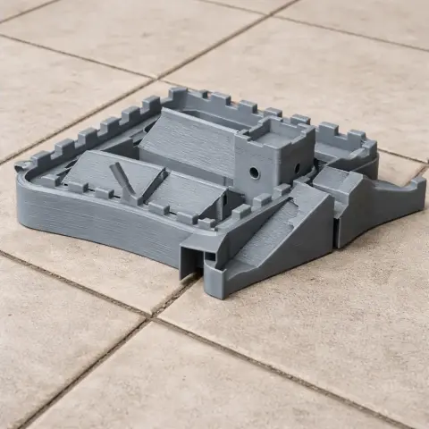 3D printed model of Hadrian's Wall fortification, detailed with ramps and battlements, on a tiled surface.