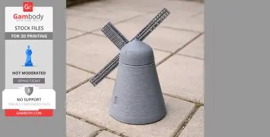 A 3D-printed miniature windmill with a conical base and two blades, displayed on paved tiles.