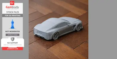 A 3D-printed model of an Aston Martin V12 Zagato on a wooden surface.
