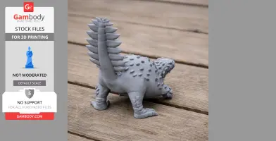 3D printed Stegouros model on wooden surface, with spiked tail and textured body.