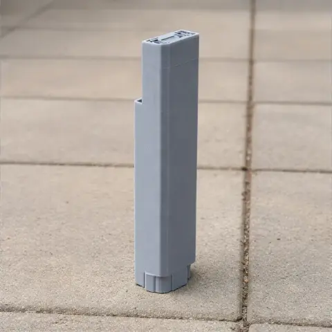 A gray 3D-printed model of the Guangxi China Resources Tower on a tiled surface.