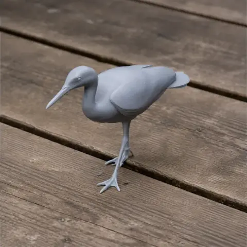 Gray 3D printed model of a Sunbittern bird, standing on wooden planks.
