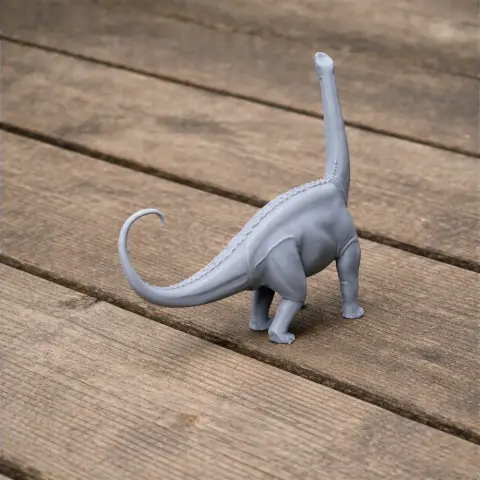 3D-printed model of a Suuwassea, a long-necked dinosaur, displayed on a wooden surface.