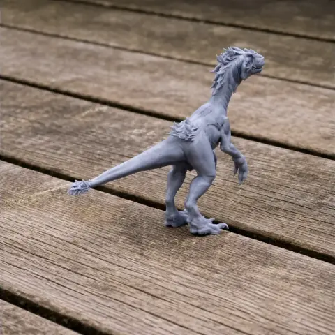 A 3D printed model of a Tachiraptor dinosaur, standing on a wooden surface.