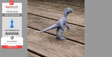 A detailed 3D-printed model of Tachiraptor, a prehistoric dinosaur, on a wooden surface.