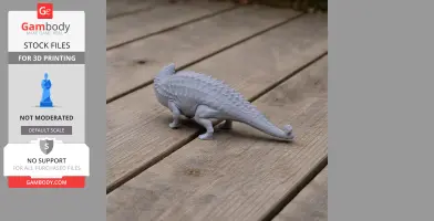 Gray 3D-printed Talarurus dinosaur model on a wooden surface.