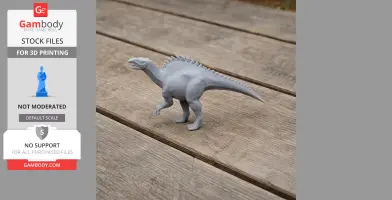 Gray 3D-printed model of a Tanius dinosaur with spines on its back, standing on a wooden surface.