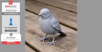 Gray 3D-printed bird figurine with detailed wings and claws, standing on wooden surface.