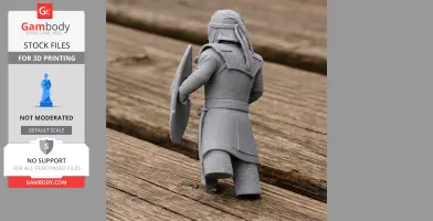 A 3D printed model of an ancient warrior in armor with a shield, standing on a wooden surface.