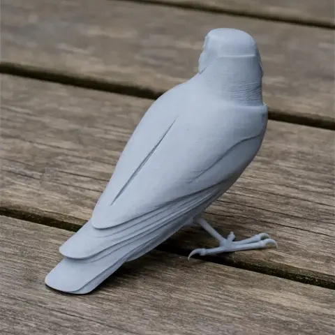 3D printed model of a prehistoric bird, Trogon, in gray, perched on wooden surface.