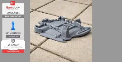 A 3D printed model of a castle layout with walls and towers, shown on a tiled surface.