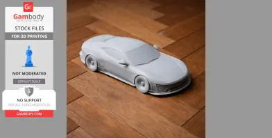A 3D printed model of an Aston Martin Valour car on a wooden floor.