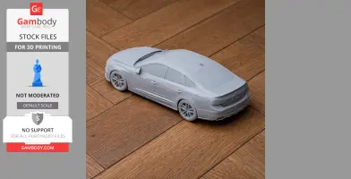 Gray 3D-printed model of an Audi A4, placed on a wooden floor, shown slightly from above.