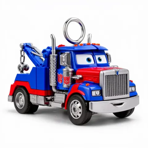 Red and blue toy tow truck with cartoon eyes, resembling a mashup of Mater and Optimus Prime, with a ring on top.