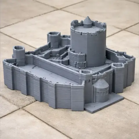 3D printed model of a medieval-style castle with towers and battlements on a tiled surface.