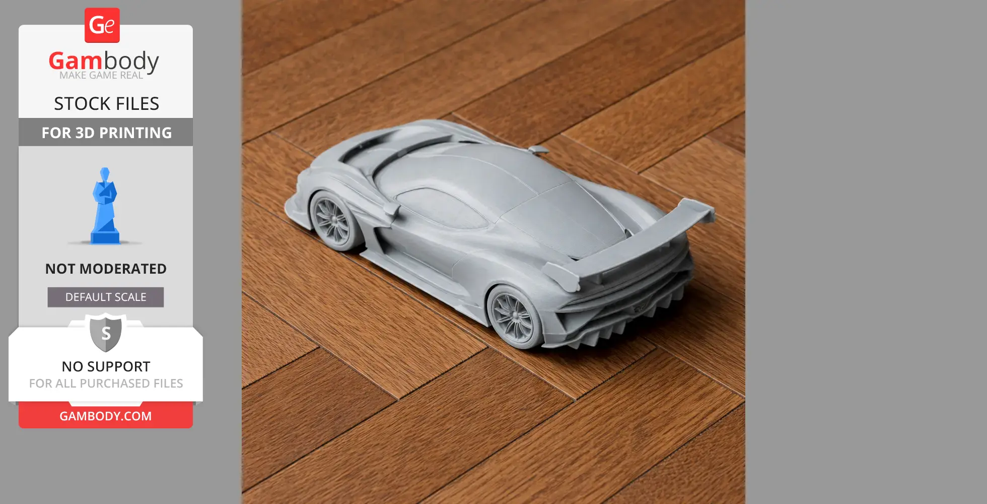 Gray 3D-printed Aston Martin Vulcan model on wooden surface, showcasing its sleek design and rear wing.