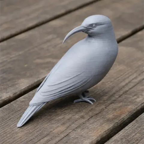 Gray 3D-printed model of a prehistoric bird with a long, curved beak, standing on a wooden surface.