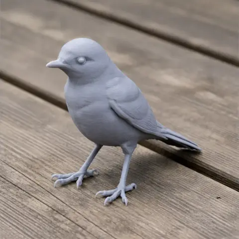 3D printed model of a wagtail bird, monochromatic, perched on a wooden surface.