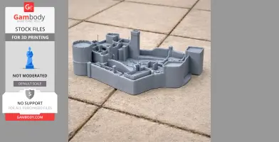 A 3D-printed model of Peckforton Castle on stone tiles, featuring detailed architectural structures.