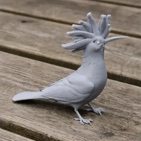 3D-printed model of a wood hoopoe bird with a distinctive crest, standing on a wooden surface.