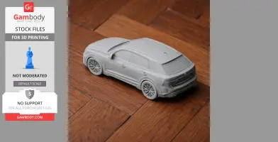 3D printed scale model of an Audi Q8 SUV on a wooden surface.
