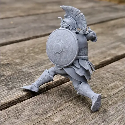 3D model of an ancient warrior in action, wearing armor, a helmet, and holding a round shield and spear.