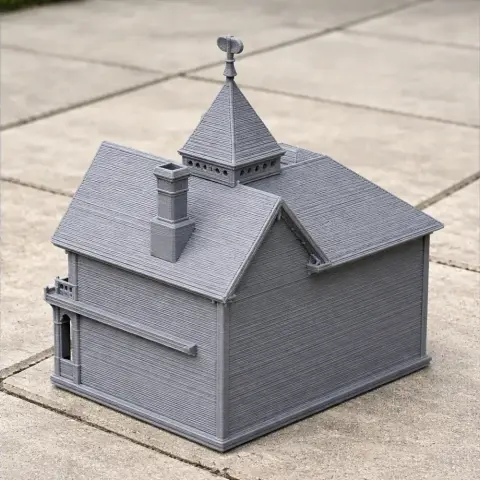3D printed model of a Queen Anne style building with detailed roof and chimney.
