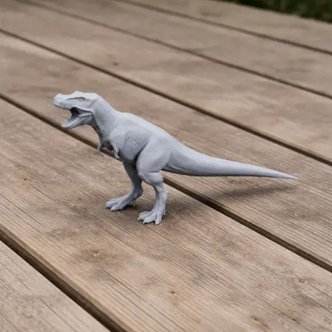 A 3D-printed model of a Zhuchengtyrannus dinosaur in a roaring pose on wooden flooring.