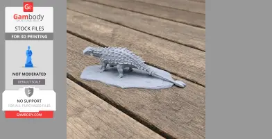 Gray 3D-printed model of a Ziapelta, a spiky armored prehistoric animal, on a wooden surface.