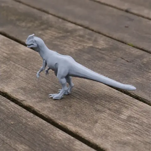 Gray 3D-printed Zupaysaurus model on a wooden surface, showcasing a prehistoric dinosaur in detail.